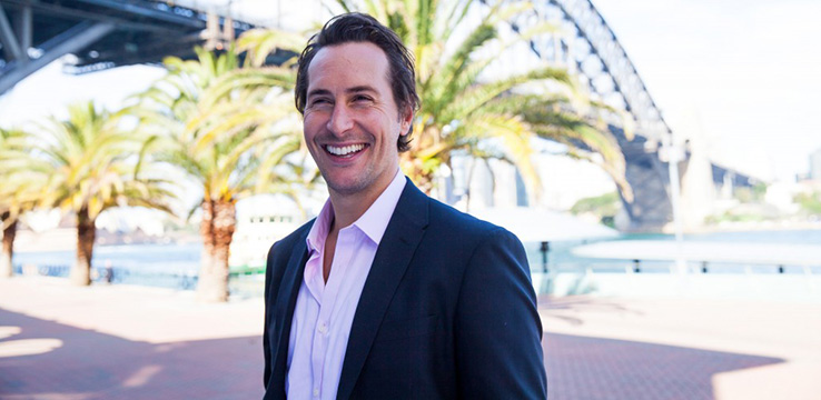 Shore co-owner Ben Wilcox in front of the Sydney Harbour Bridge